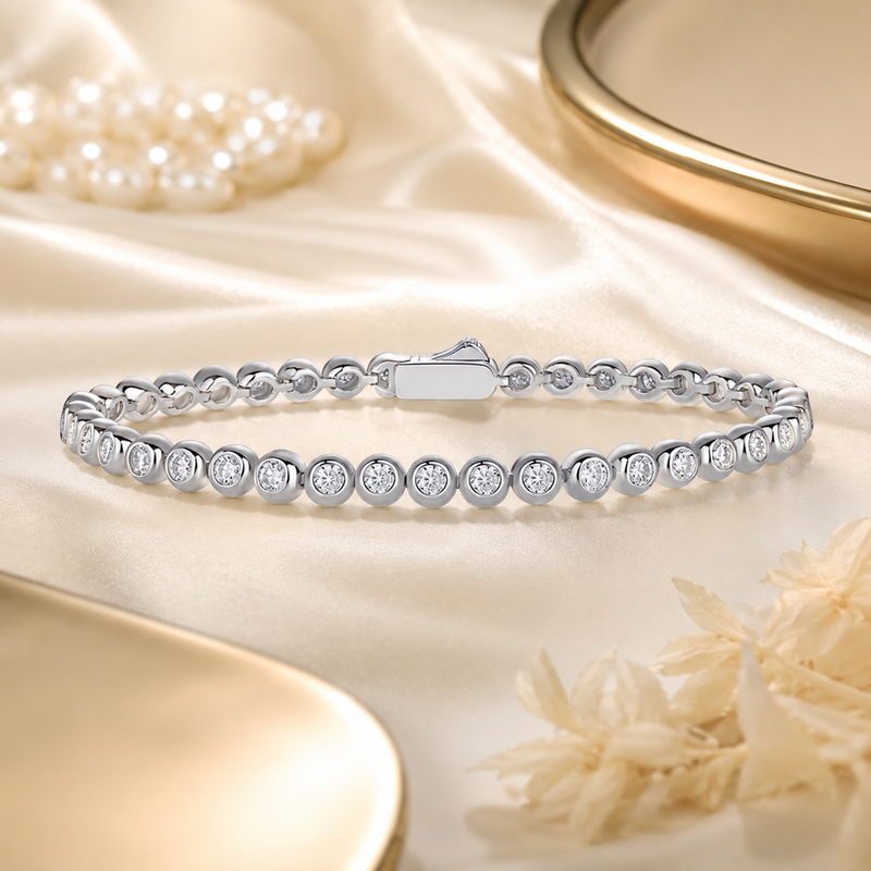 Celeste silver bezel-set moissanite tennis bracelet on ivory satin