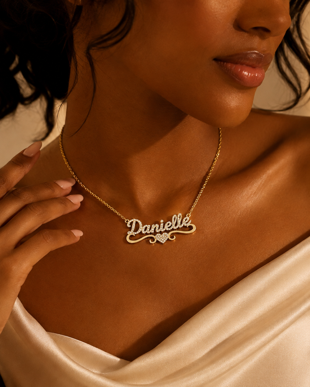 Black woman wearing a personalized Danielle crystal name necklace