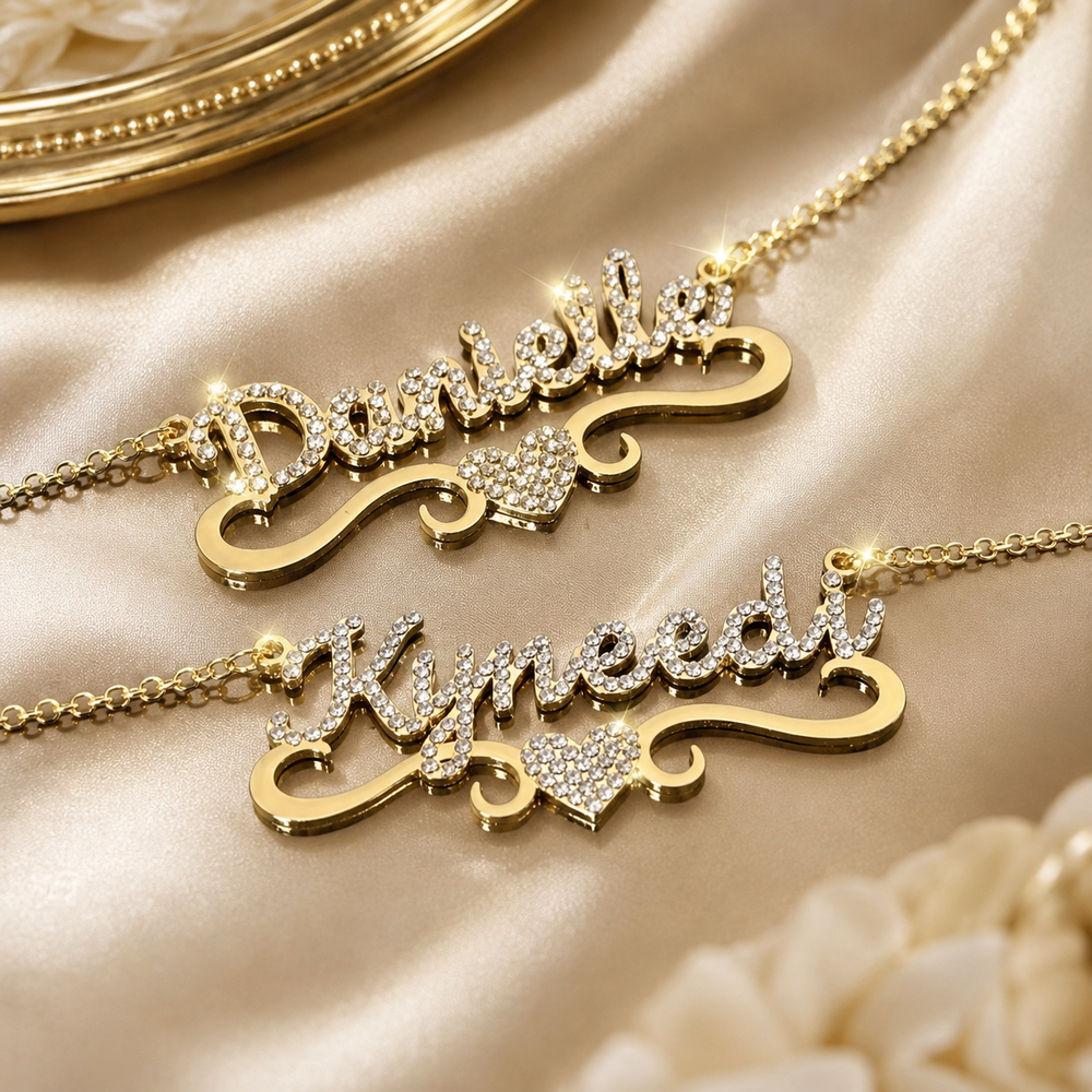 Danielle and Kynedi crystal name necklaces on ivory satin