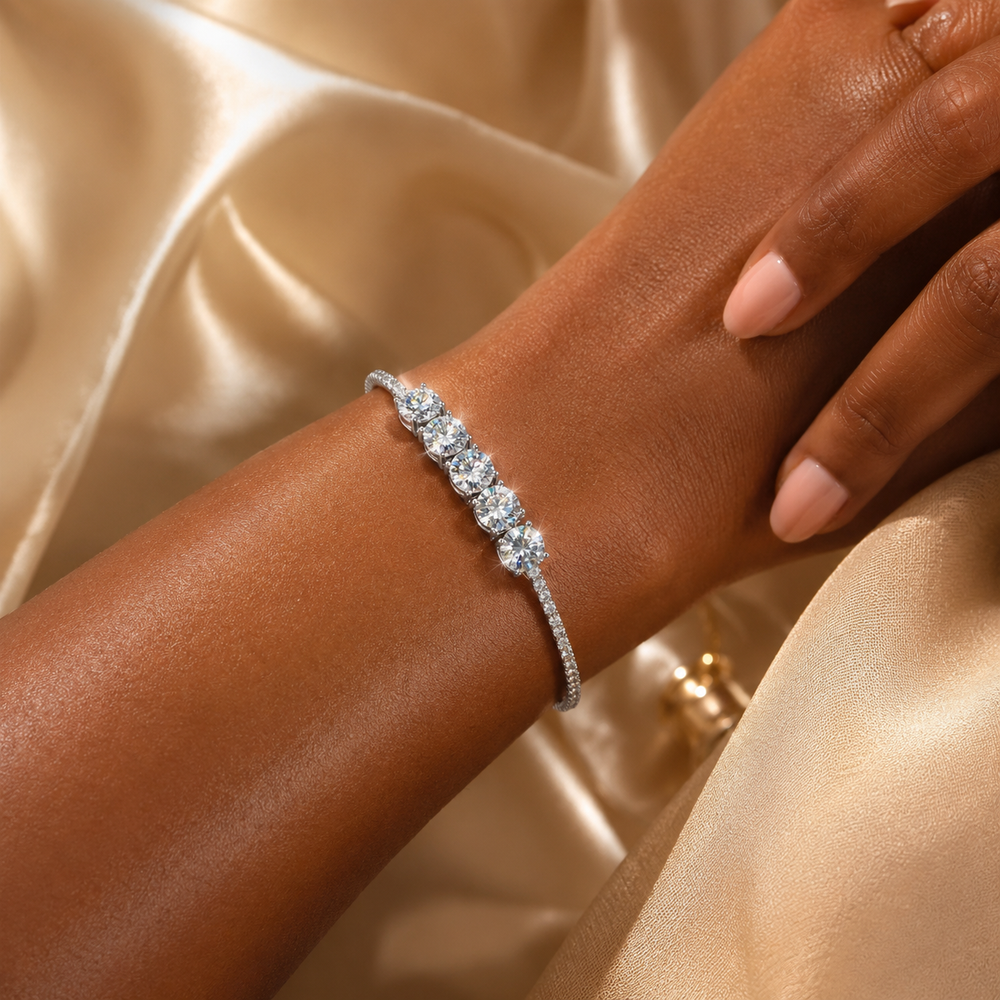 Woman wearing the Quintessa five-stone moissanite bracelet