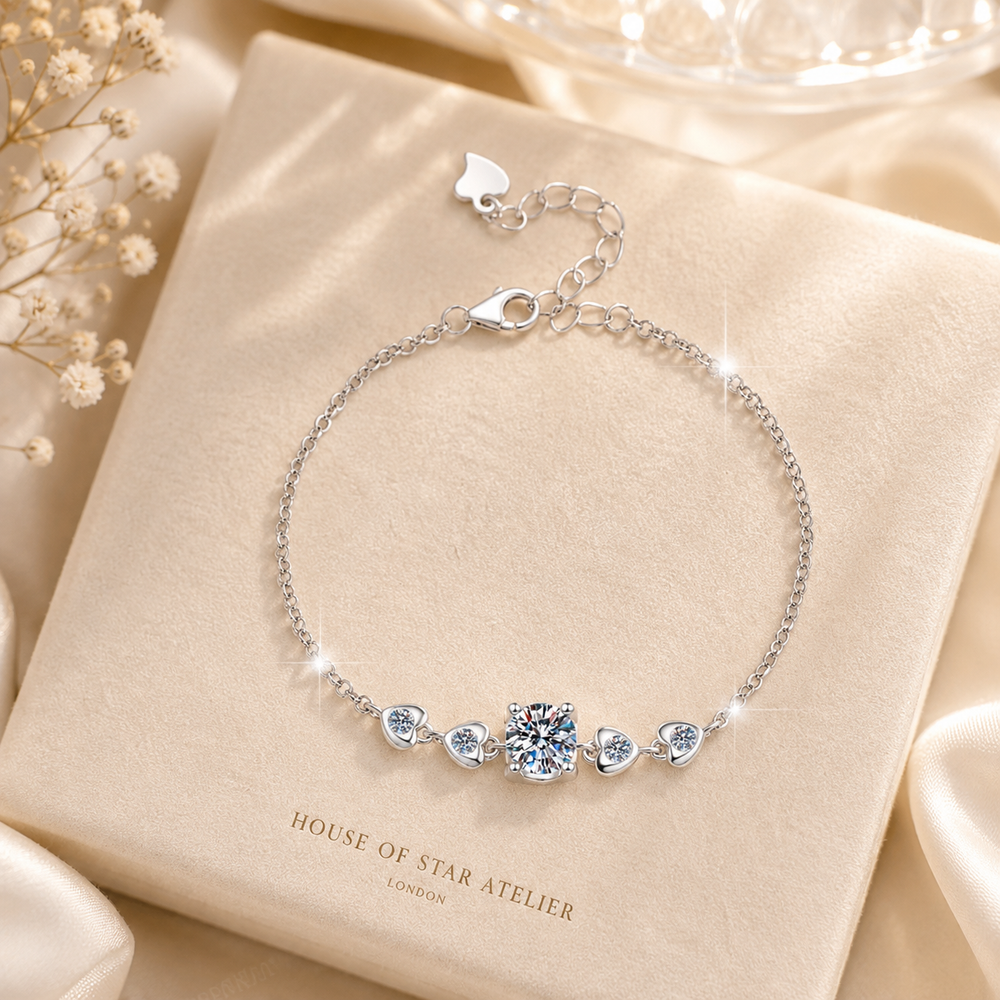 One carat moissanite heart bracelet presented on champagne jewelry box