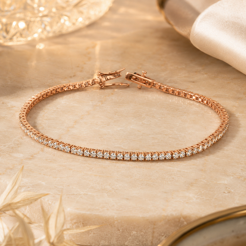 Rose gold moissanite tennis bracelet on marble with crystal accents