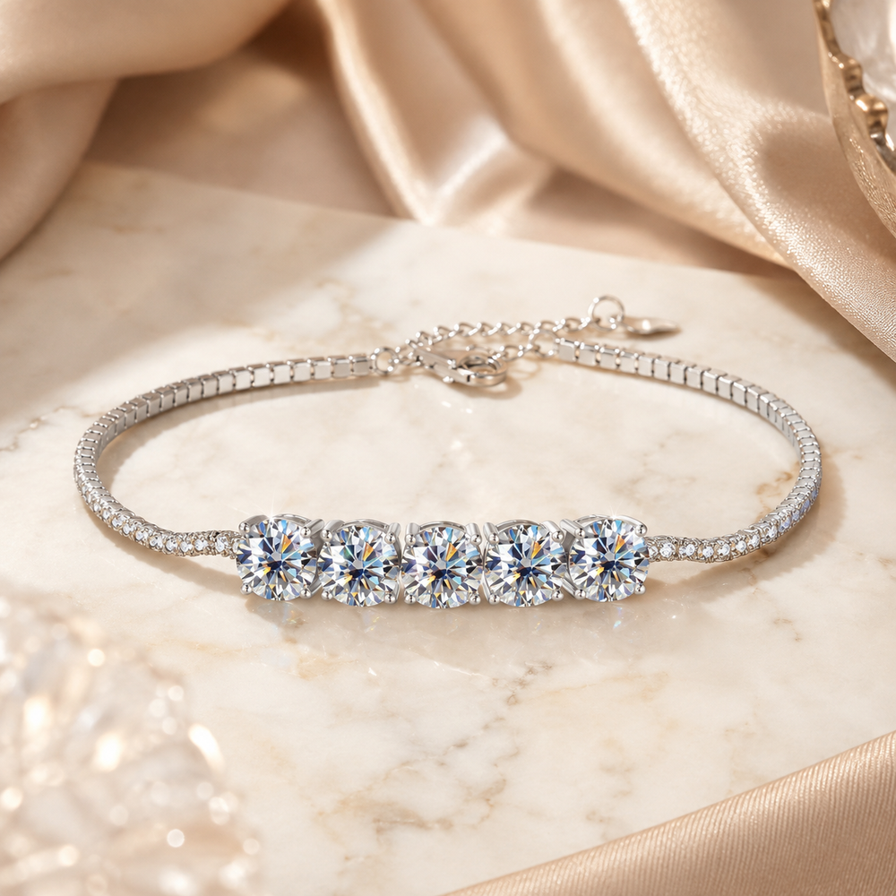 Sterling-silver five-stone moissanite bracelet on ivory marble