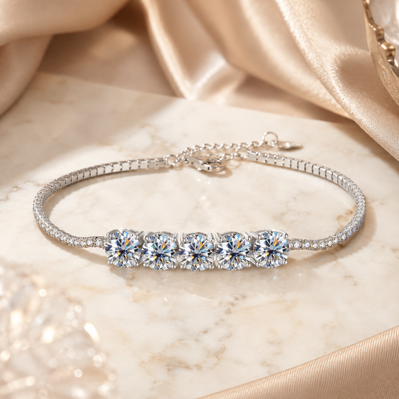 Sterling-silver five-stone moissanite bracelet on ivory marble