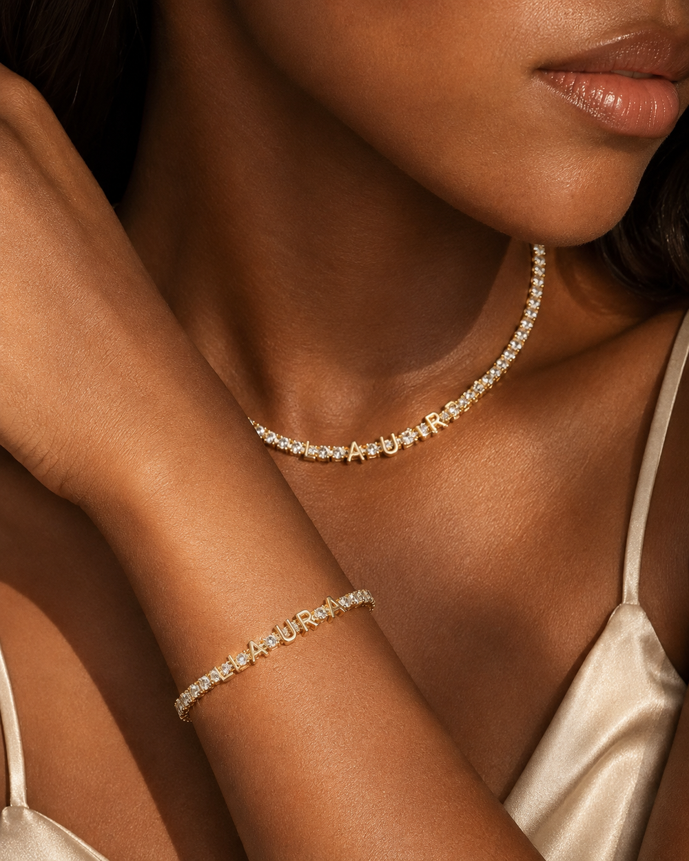 Woman wearing personalized gold tennis bracelet in warm light
